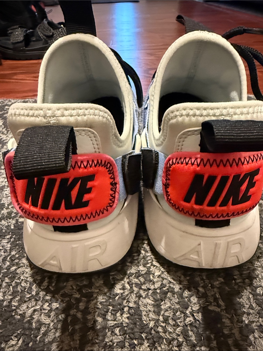 Nike White Sneakers with Black Laces and Pink Accent